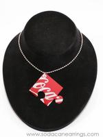 Puzzle piece necklace hand made from recycled Coca-Cola can